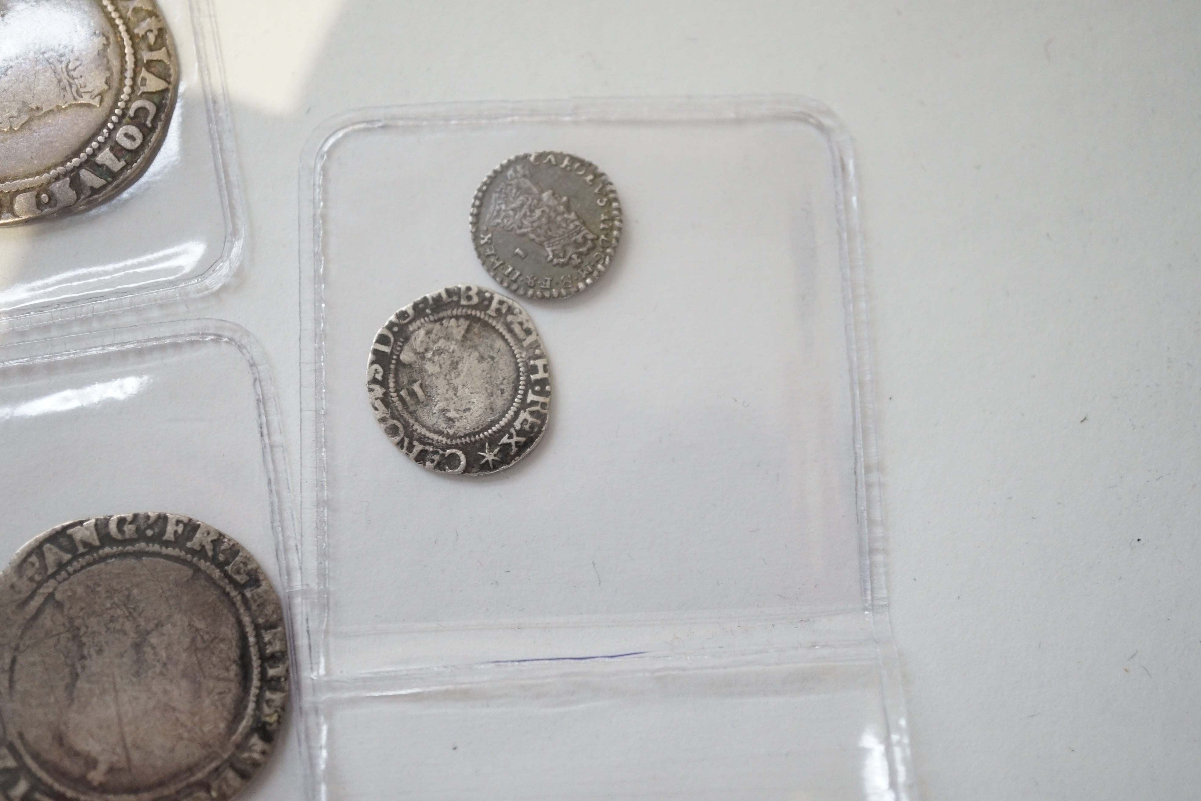 British Tudor and Stuart hammered silver coins, an Elizabeth I shilling and two sixpences, a James I sixpence, two Charles I shillings, a Charles II penny, first issue, 1660-62, (S3311) VF, twopence (S3310) (8)
